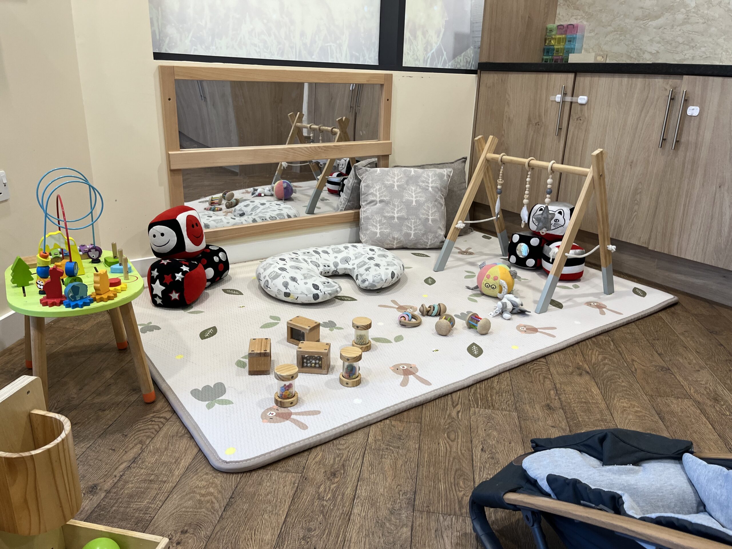 A sensory area for babys to explore textures, colours and sounds