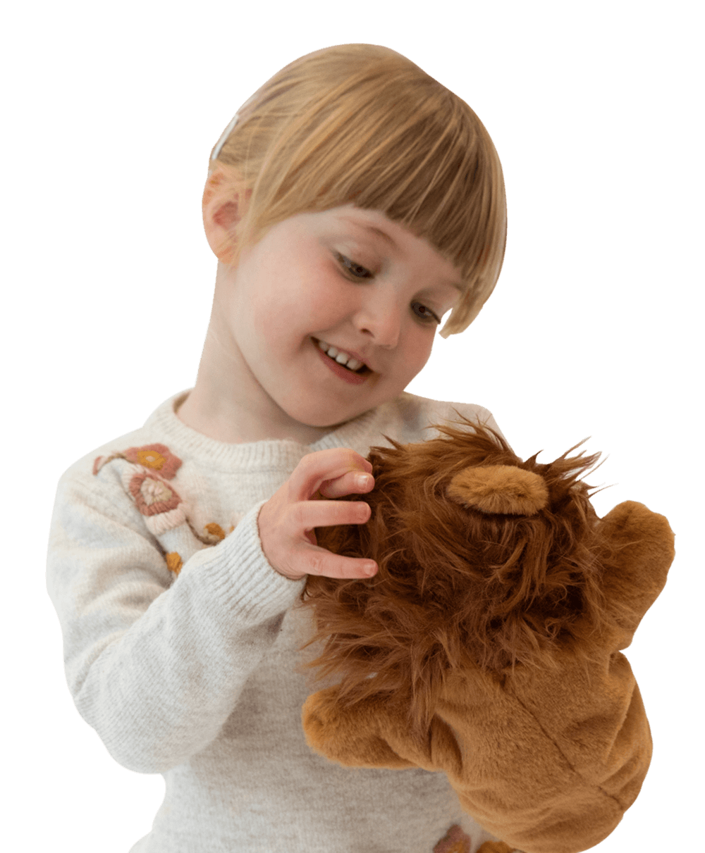 A child playing with a tiger toy