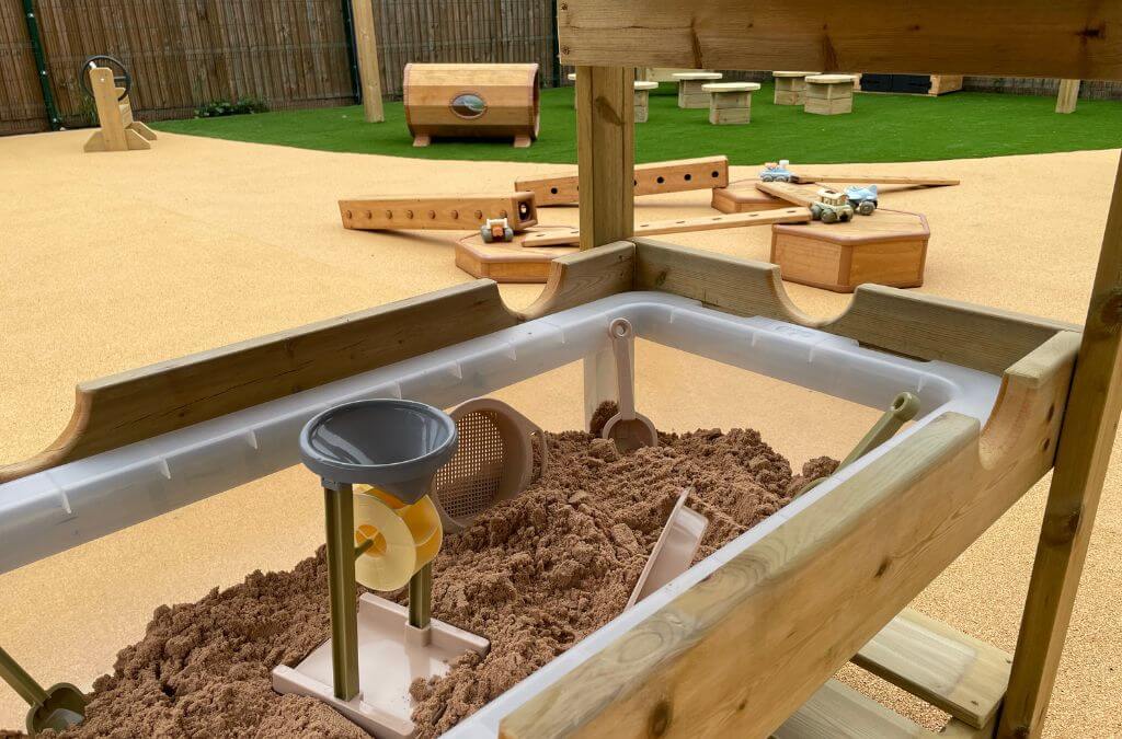 Outdoor sand box with tools