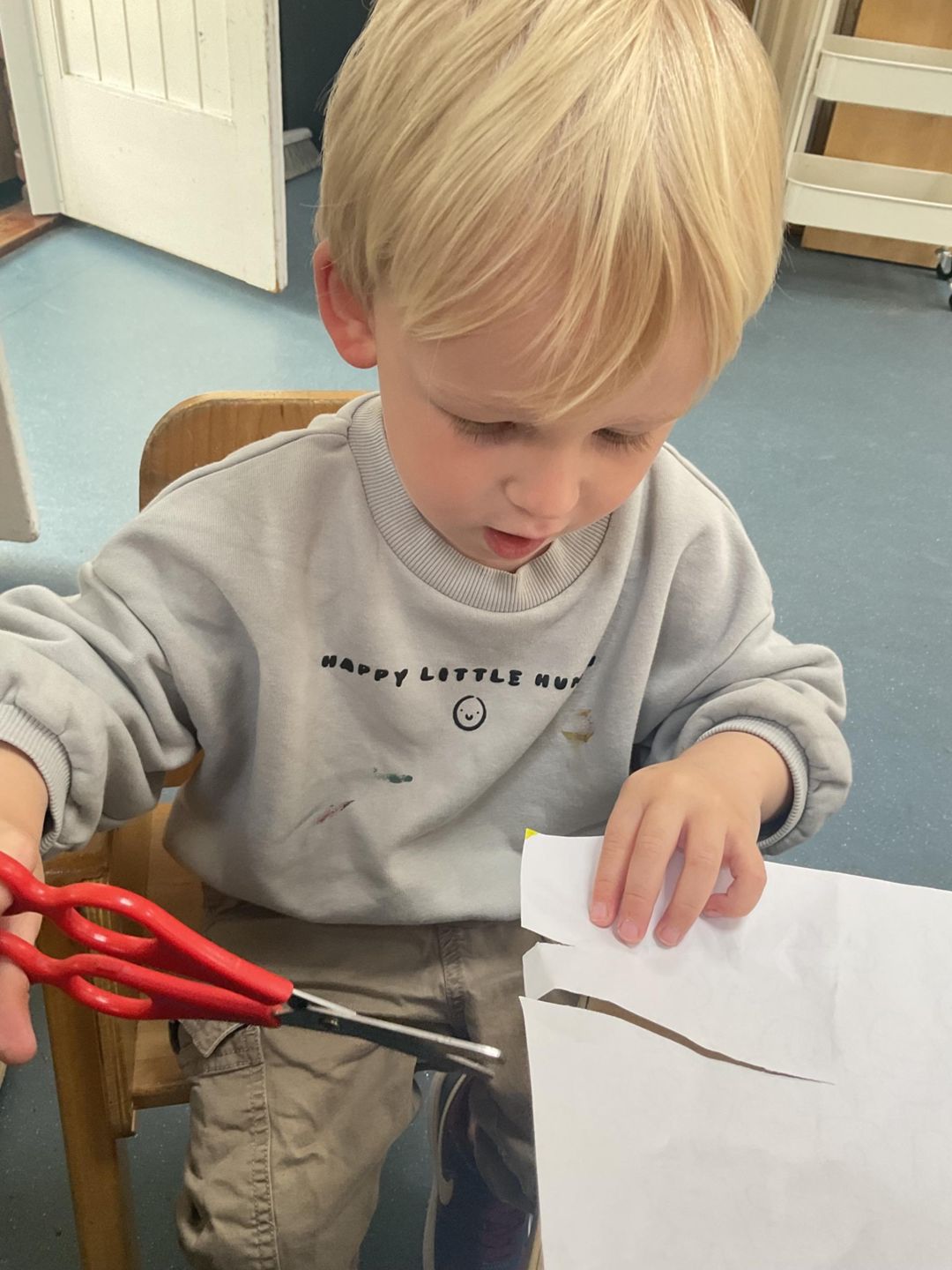 child cutting paper