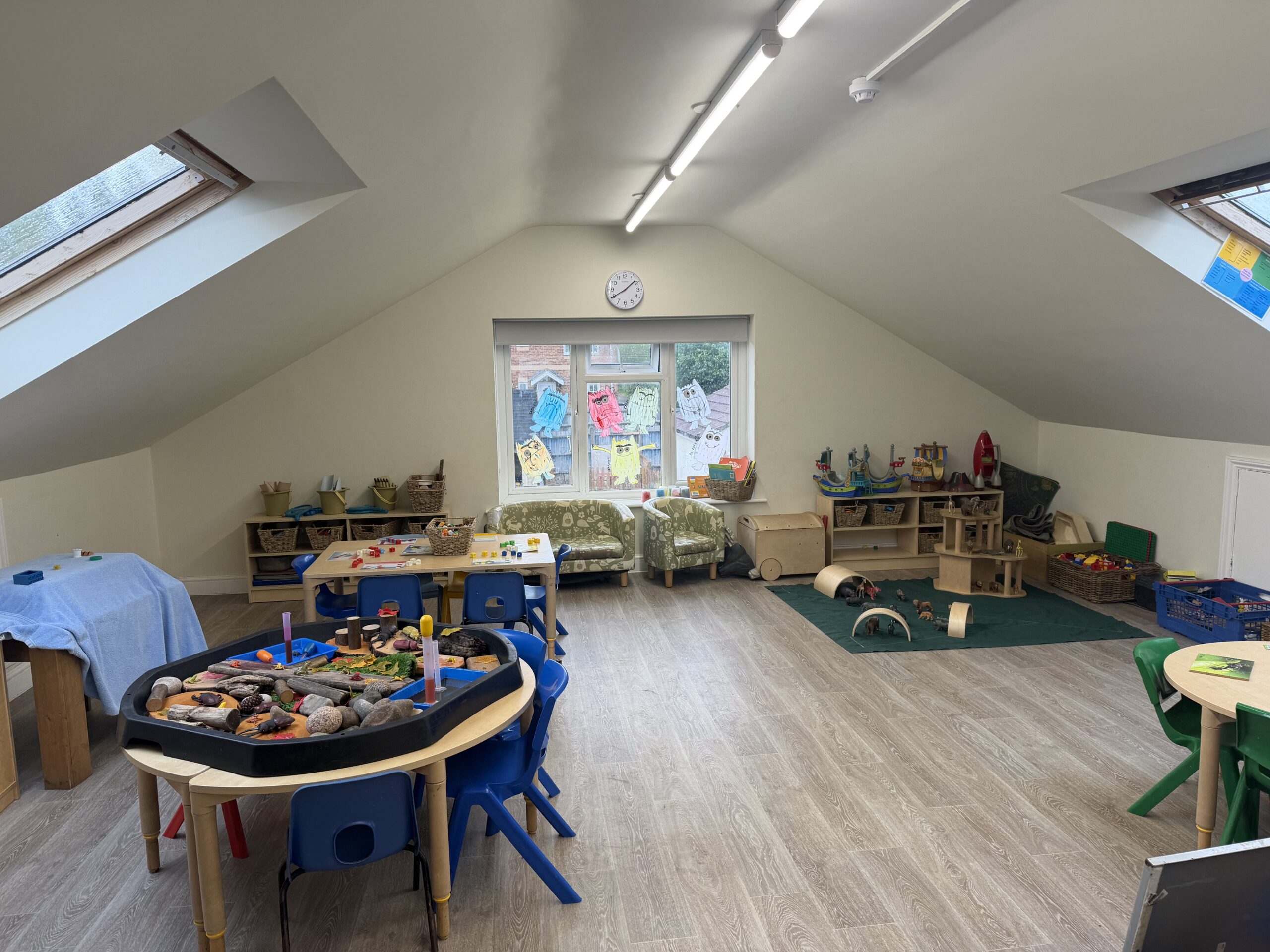 preschool nursery room set up with lots of age appropriate resources