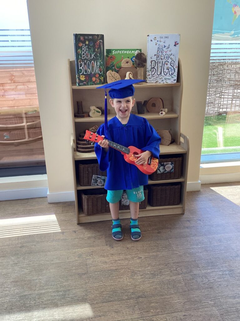 Child posing happy after graduating from pre-school