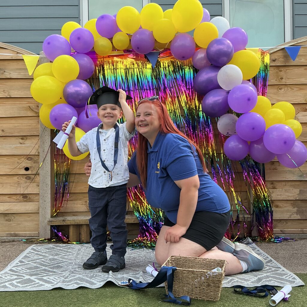 Child posing happy after graduating from pre-school