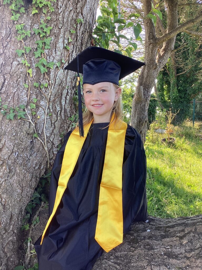 Child posing happy after graduating from pre-school