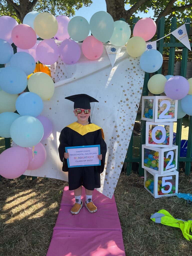 Child posing happy after graduating from pre-school