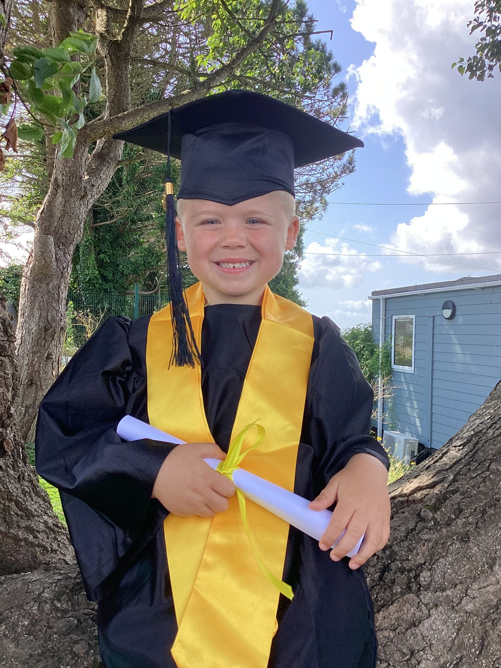 Child posing happy after graduating from pre-school