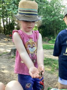 Children in the garden with a butterfly at Happy Days Penair