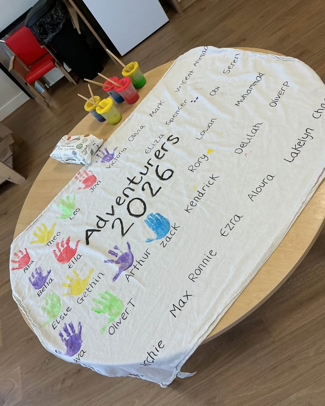 Graduation at Happy Days Yate. A banner with childrens handprints next to their names